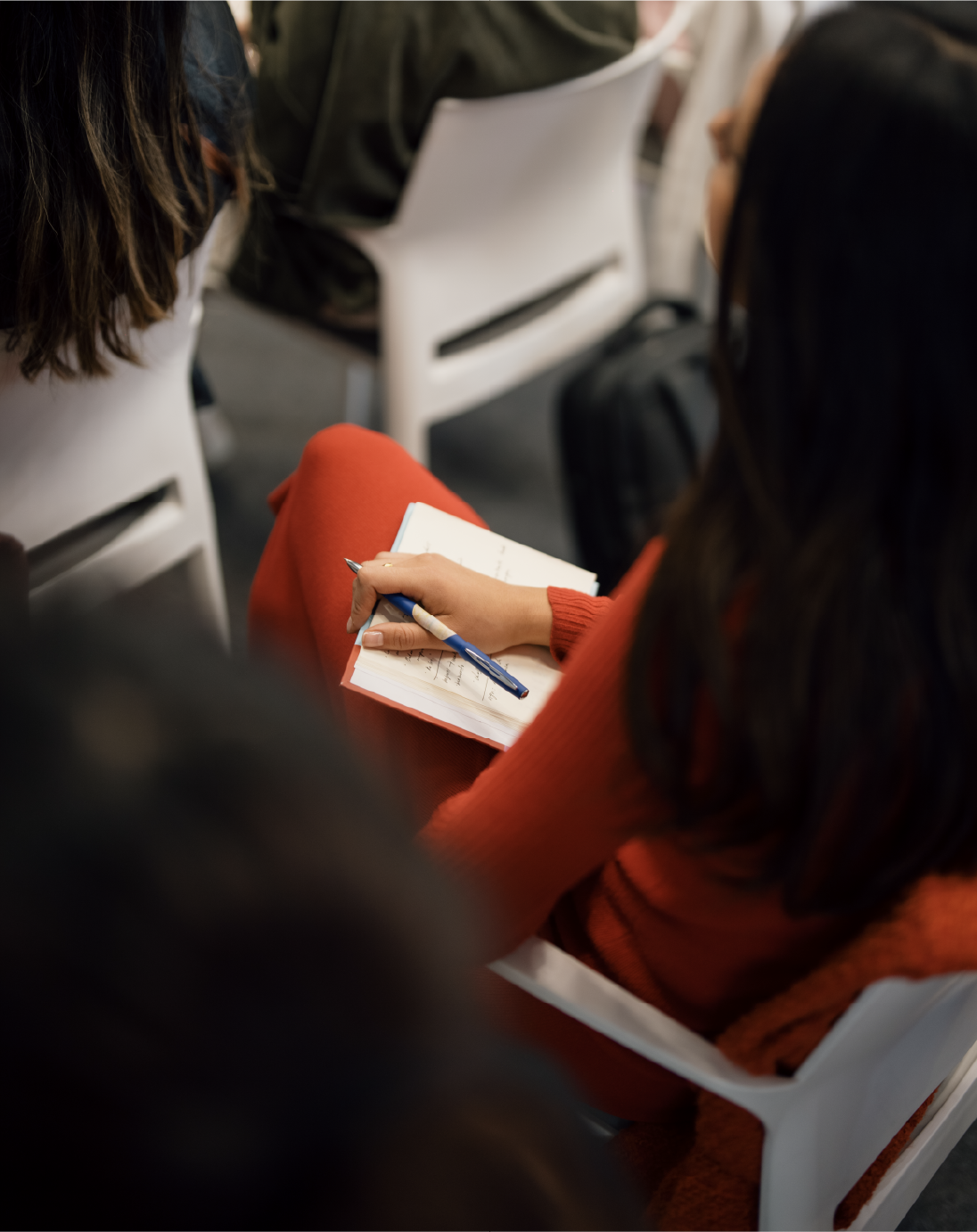 Person writing in a notebook